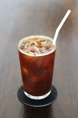 Iced americano coffee with ice on table
