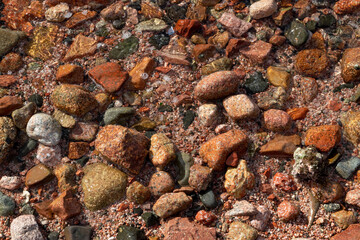 Red Sand and Stones of the red Sea Coast, Natural Texture Background