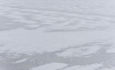 Snow Covered Ice on a Frozen River in February in Latvia