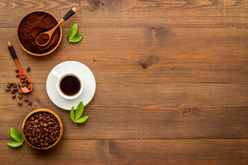 Coffee background. Coffee beans and hot drink, top view