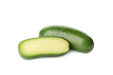 Cut and whole seedless avocados isolated on white