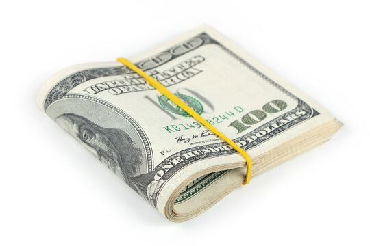Big Stack of Folded Hundred Dollar Bills Isolated on White Background.