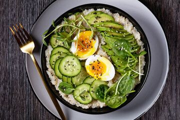quinoa bowl with greens, avocado and boiled egg