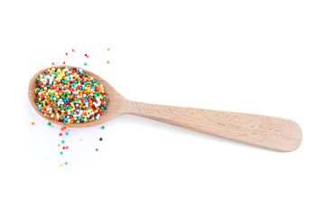 Colorful sprinkles in spoon on white background. Confectionery decor
