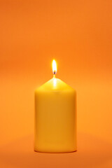Coloured candle against the same coloured background
