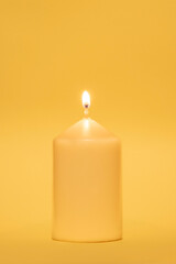 Coloured candle against the same coloured background