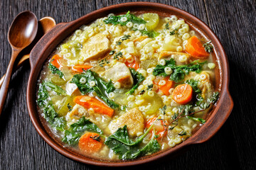 chicken kale veggies soup in a bowl