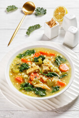 chicken kale veggies soup in a bowl