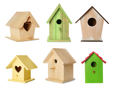 Set with different beautiful bird houses on white background