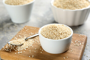 White sesame seeds on light grey table