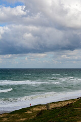 clouds over the sea, Blue sky, clouds, wavy sea and green grass, earth