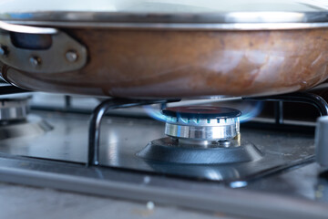 Gas stove with a professional pan on it. How to clean gas stove.