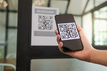 Qr code payment. E wallet. Man scanning tag accepted generate digital pay without money.scanning QR code online shopping cashless payment and verification.technology concept