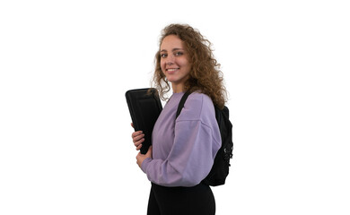 Fototapeta premium Young student woman with a backpack is holding a computer on white background.