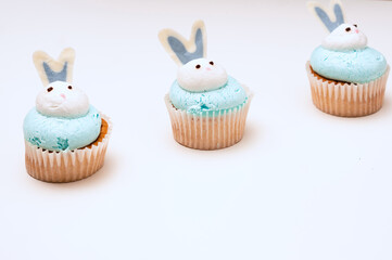 Bunch of Easter muffins on white background. Easter concept. Rabbit cupcake