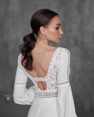 Portrait og young beautiful woman wearing white wedding bridel dress. Pretty slim bride with...