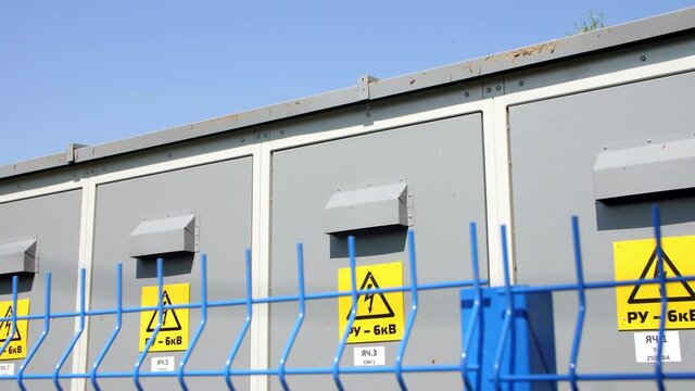 Electrical distribution substation with cases line in park