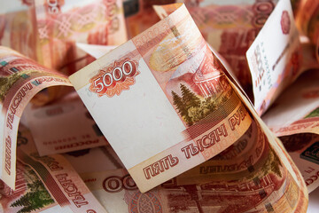 Heap of five thousand russian rubles banknotes as background