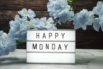Happy Monday word in light box with Flowers Decoration