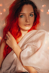 red-haired European girl with beautiful eye makeup in the sunlight
