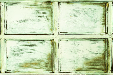 Green wooden background. celadon old window. retro door. cracks and scuffs, rustic.