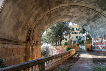 Zoagli, Genoa, Italy - 02 21 2021: view of Canevaro castle from railway bridge underpass