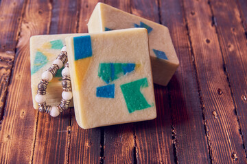 A fragrant organic handmade soap with a geometric pattern.