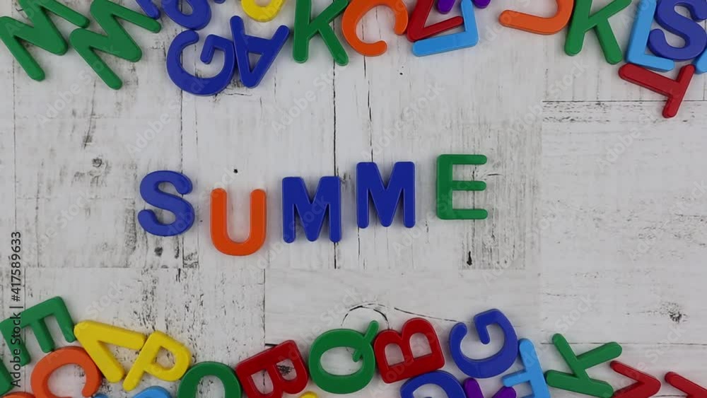 Poster word - summer - in bright colorful alphabet letters with top and bottom matching border on grey wood