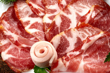 Prosciutto crudo or jamon, top view. Italian antipasto. Traditional Spanish Jamon Serrano ham, Prosciutto Crudo, Parma ham