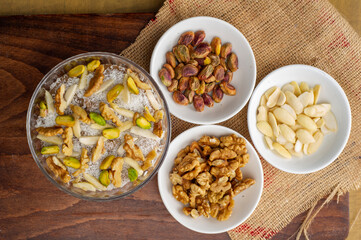 Lebanese traditional dessert meghli on a wooden table