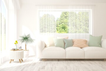 White living room with sofa and summer landscape in window. Scandinavian interior design. 3D illustration
