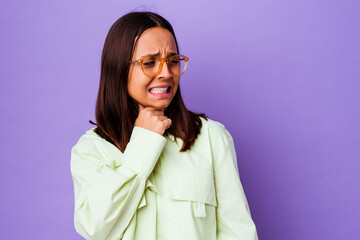 Young mixed race woman isolated touching back of head, thinking and making a choice.