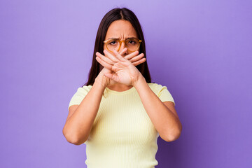 Young mixed race woman isolated doing a denial gesture