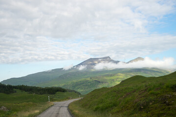Isle of Mull Scotland UK countryside scene with Ben More mountain and a single track road