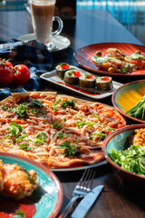 Yummy homemade pizza on a buffet table in a beautiful setting, sunny lighting