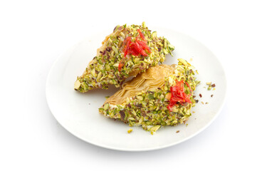 Oriental Arabic sweet warbat with qishta, kadayif, kunafa, with pistachio and cheese.