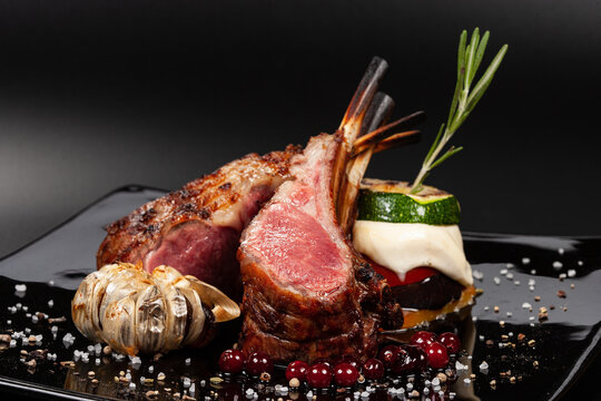 Lamb square with rosemary on a dark background