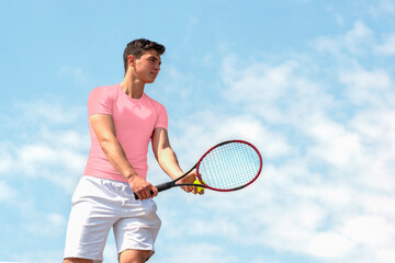 Young handsome tennis player with racket and ball prepares to serve at beginning of game or match. Beautiful colorful sports background, banner with copy space