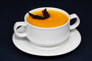a plate of pumpkin soup puree