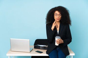 African american business woman working in her workplace Looking front