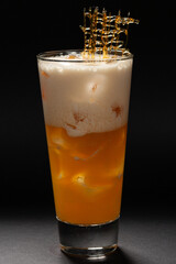 pina colada cocktail on a black background