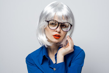 elegant woman in white wig red lips glasses glamor blue shirt close-up