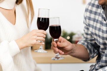 Close up of man and woman drinking red wine
