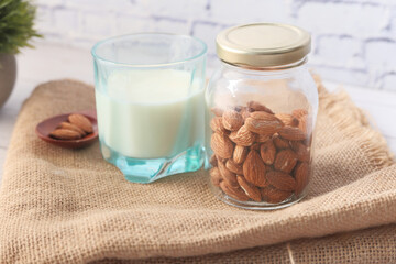  almond nut and milk on table top down