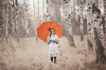 young woman umbrella autumn / autumn trendy look, model with umbrella, rainy cold weather