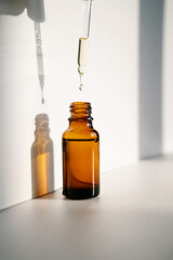 a drop falls into a cosmetic bottle