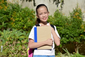 Fototapeta premium Female Student And Appreciation With Books