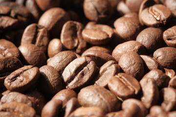 close up of fresh coffee beans on black background 