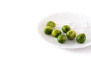 Set of brussel sprouts with lollipop sticks isolated on white background.Copy space