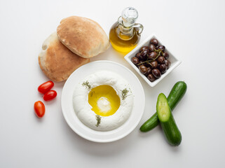 Lebanese food of Labneh Yogurt cheese with Olives and veggies.